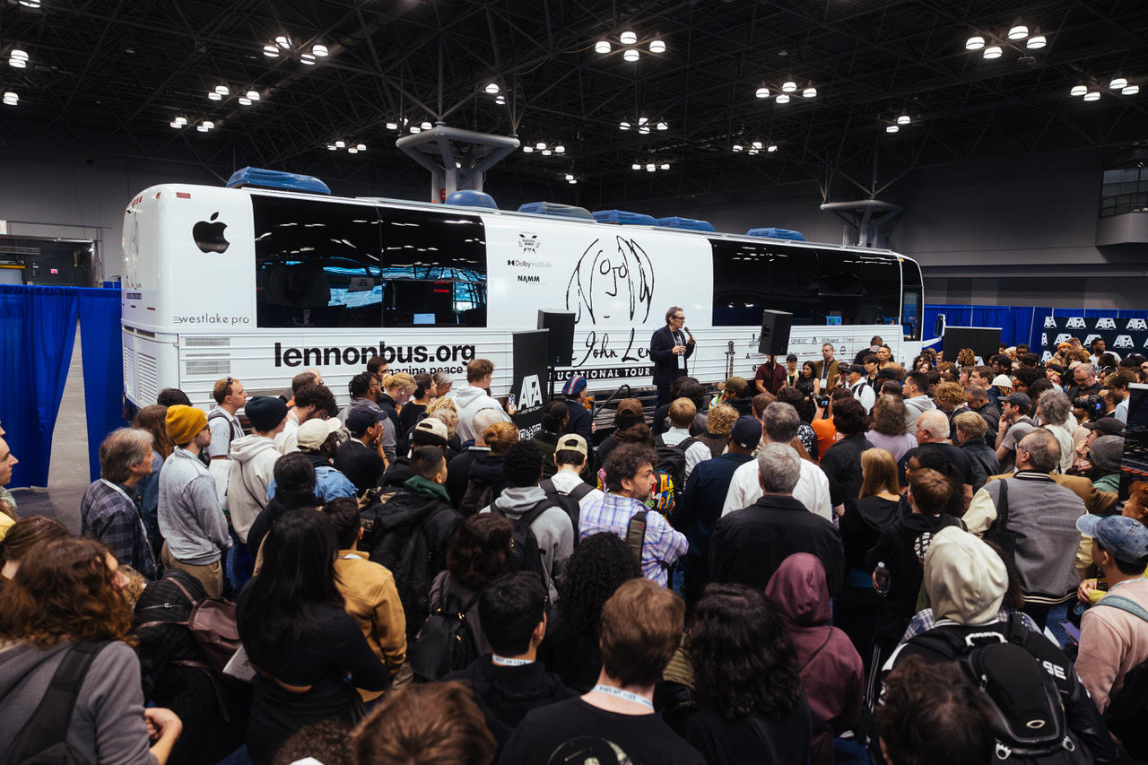 Brian Rothschild, Founder of the Lennon Bus, addresses crowd at the AES Show in front of newly wrapped and designed Bus